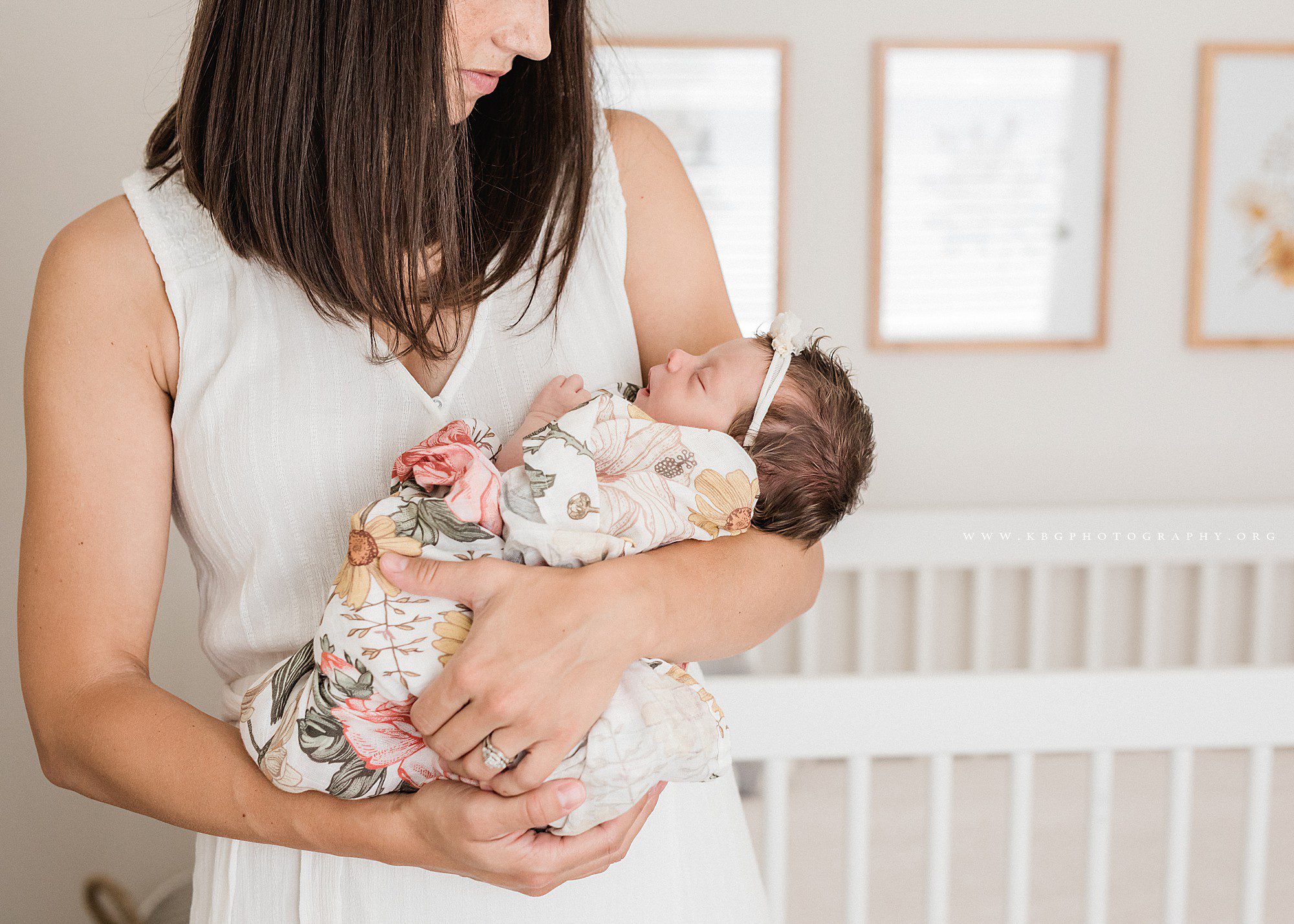 atlanta newborn photographer - mom holding newborn baby girl 