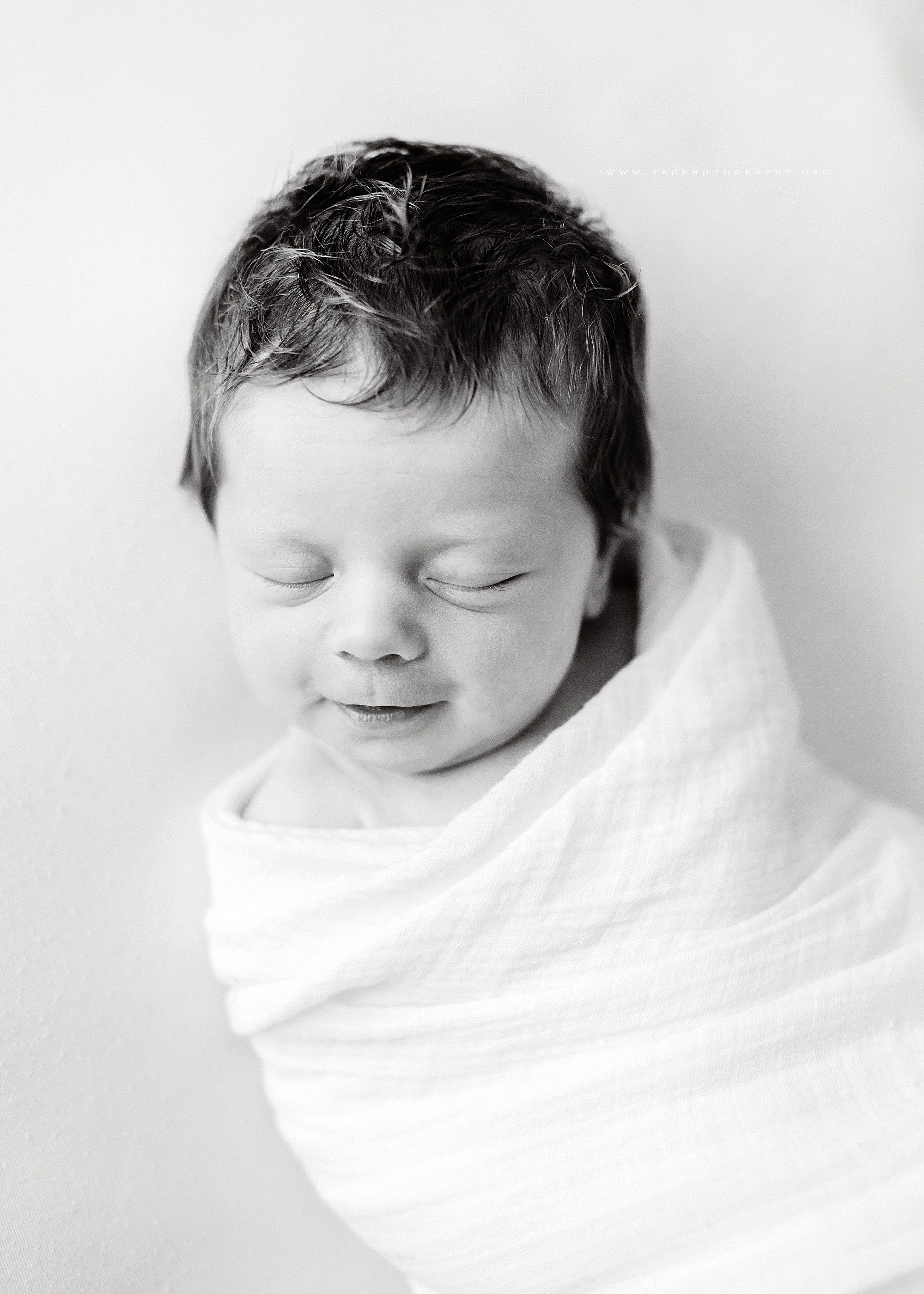 atlanta newborn photographer - newborn girl in white blanket
