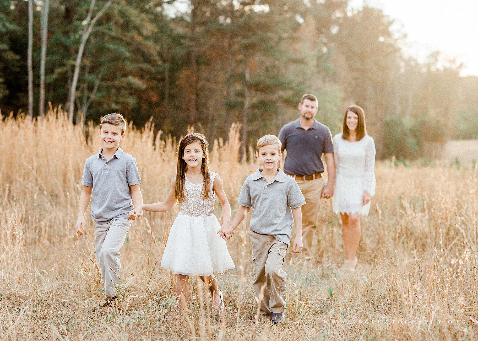family of five walking in a field in Marietta, Georgia - marietta family photography 