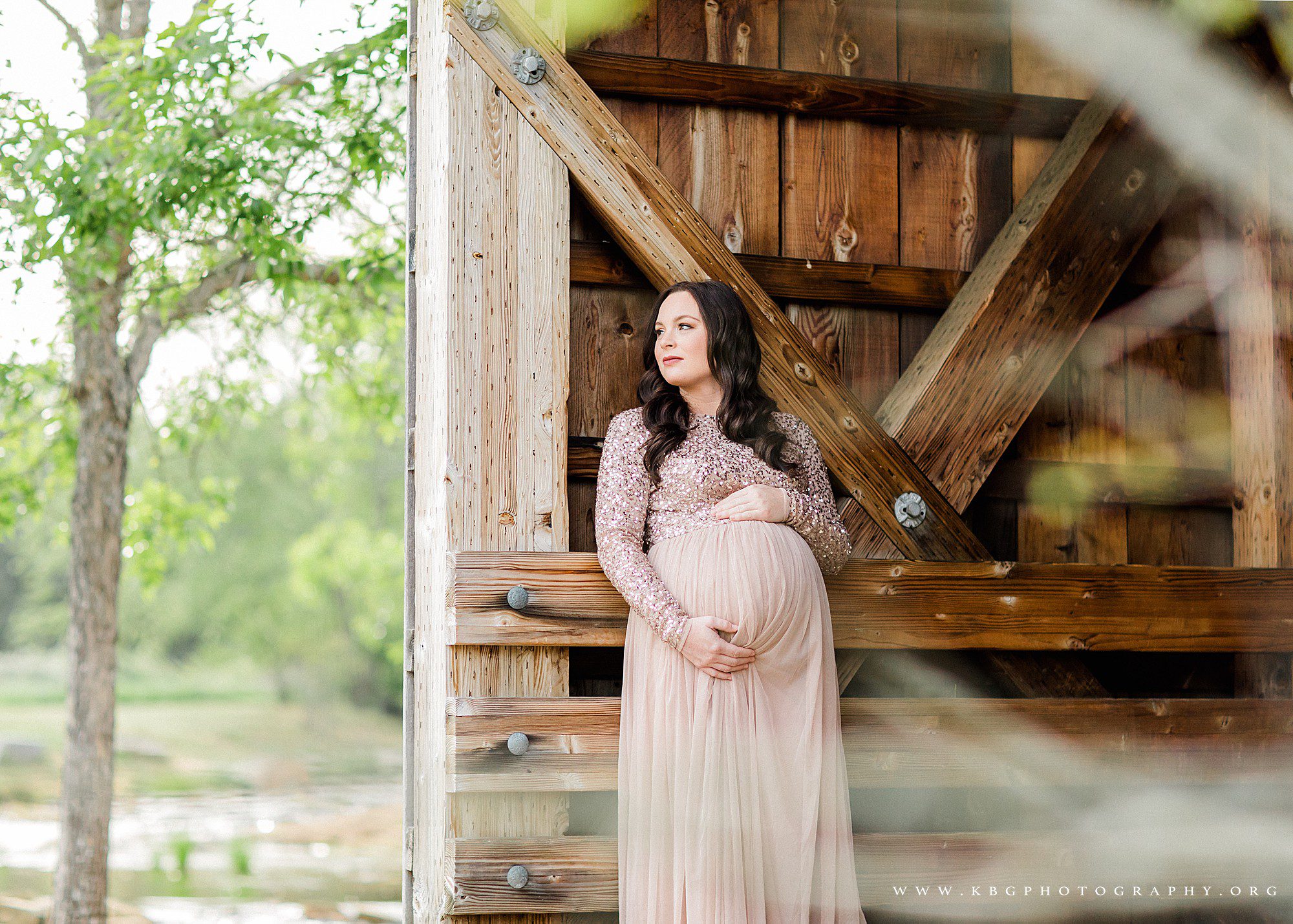 expecting mother posing under covered bridge in garrard landing park - atlanta maternity photographer
