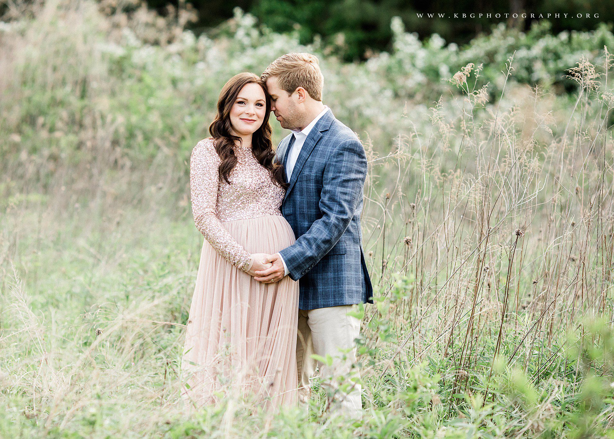 expecting couple posing in field - atlanta maternity photographer