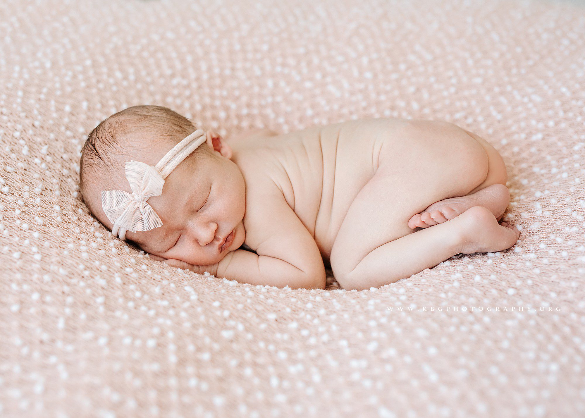 baby girl newborn posed on beanbag - marietta studio newborn