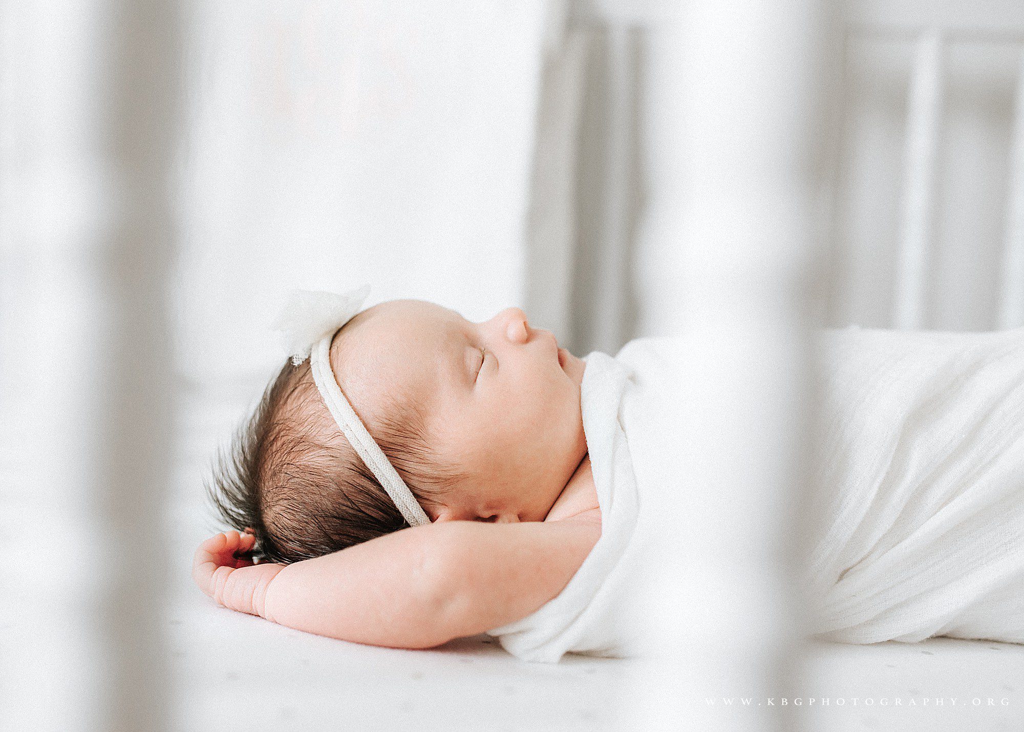 newborn baby girl in her crib - marietta baby photographer 