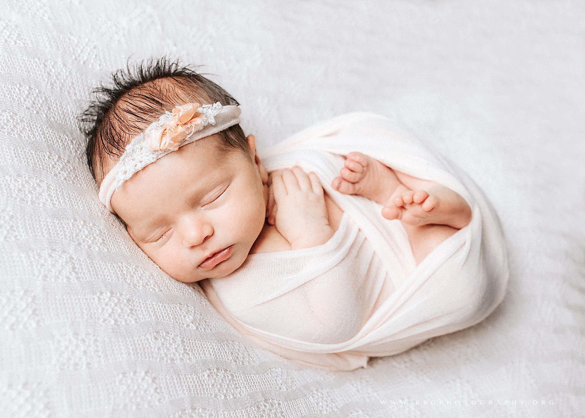 newborn baby girl posed on beanbag - marietta newborn photographer