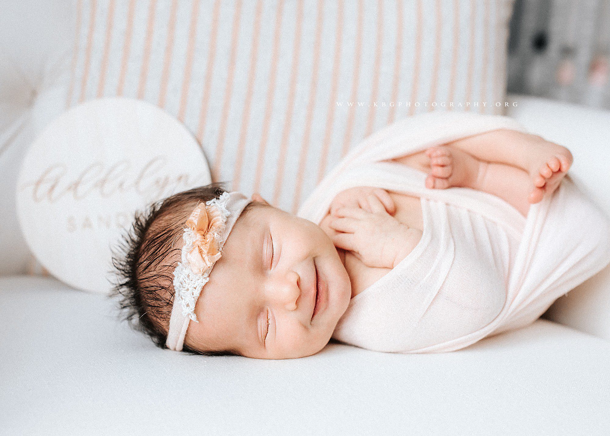 newborn girl posed on glider - marietta newborn photographer