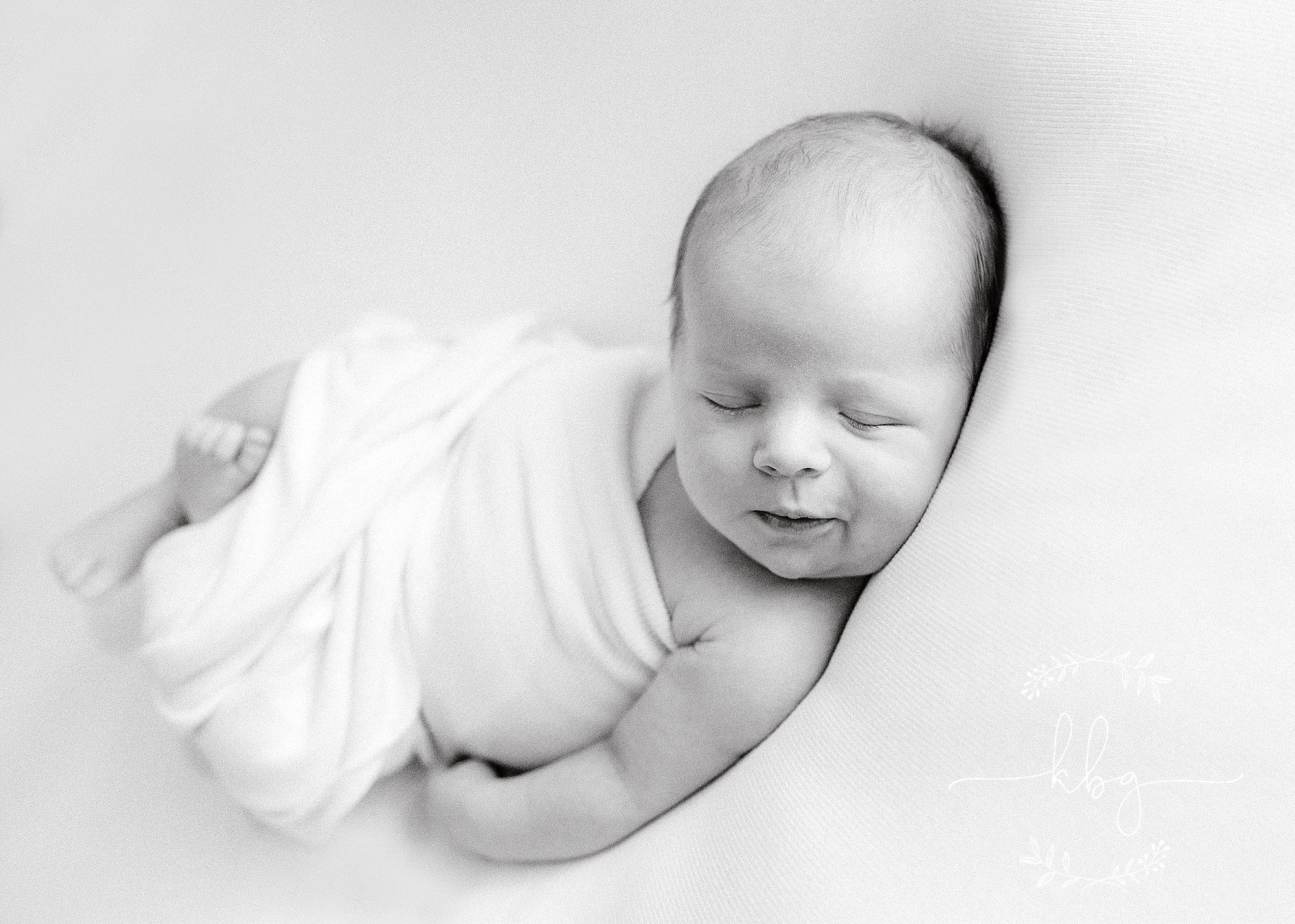 newborn boy posing on beanbag - atlanta newborn photographer