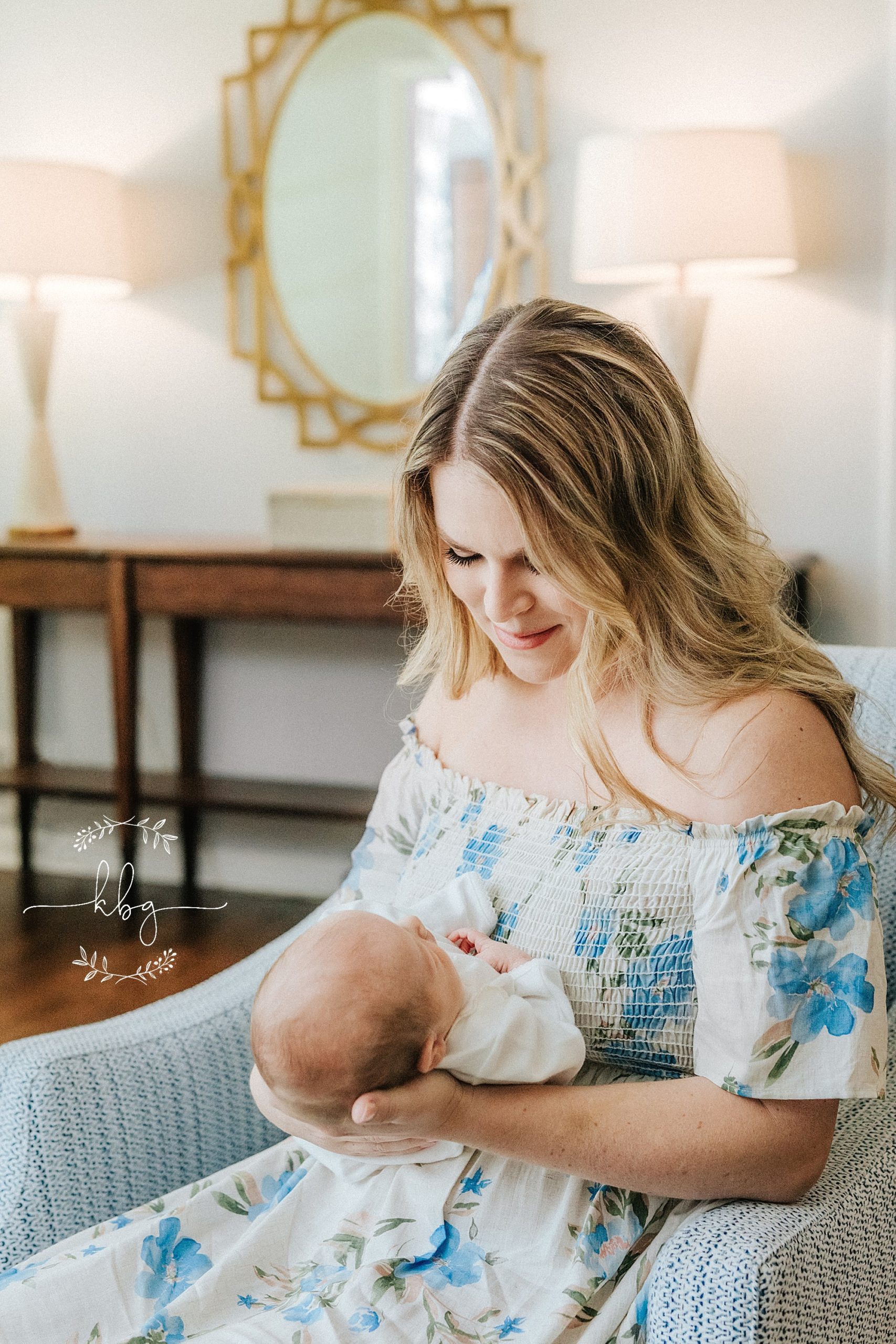 new mom holding baby boy in living room - atlanta lifestyle photographer