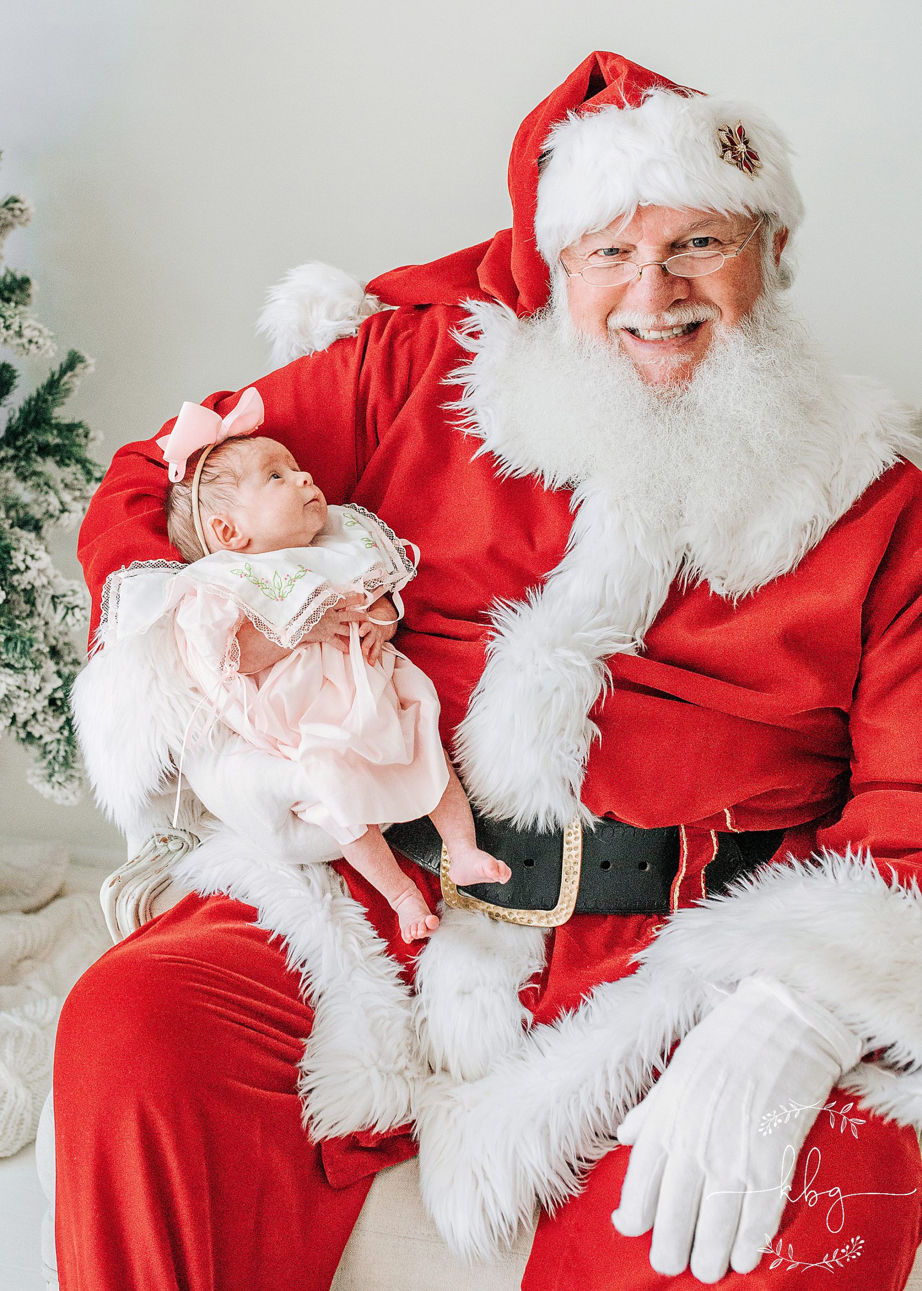 Santa holding a little baby - marietta santa mini sessions