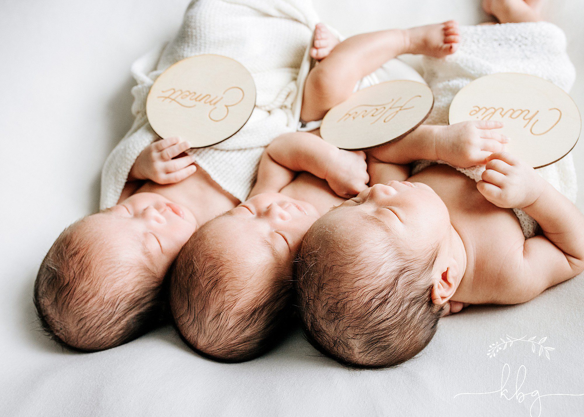 smyrna newborn photographer - triplet newborn boys posing on beanbag