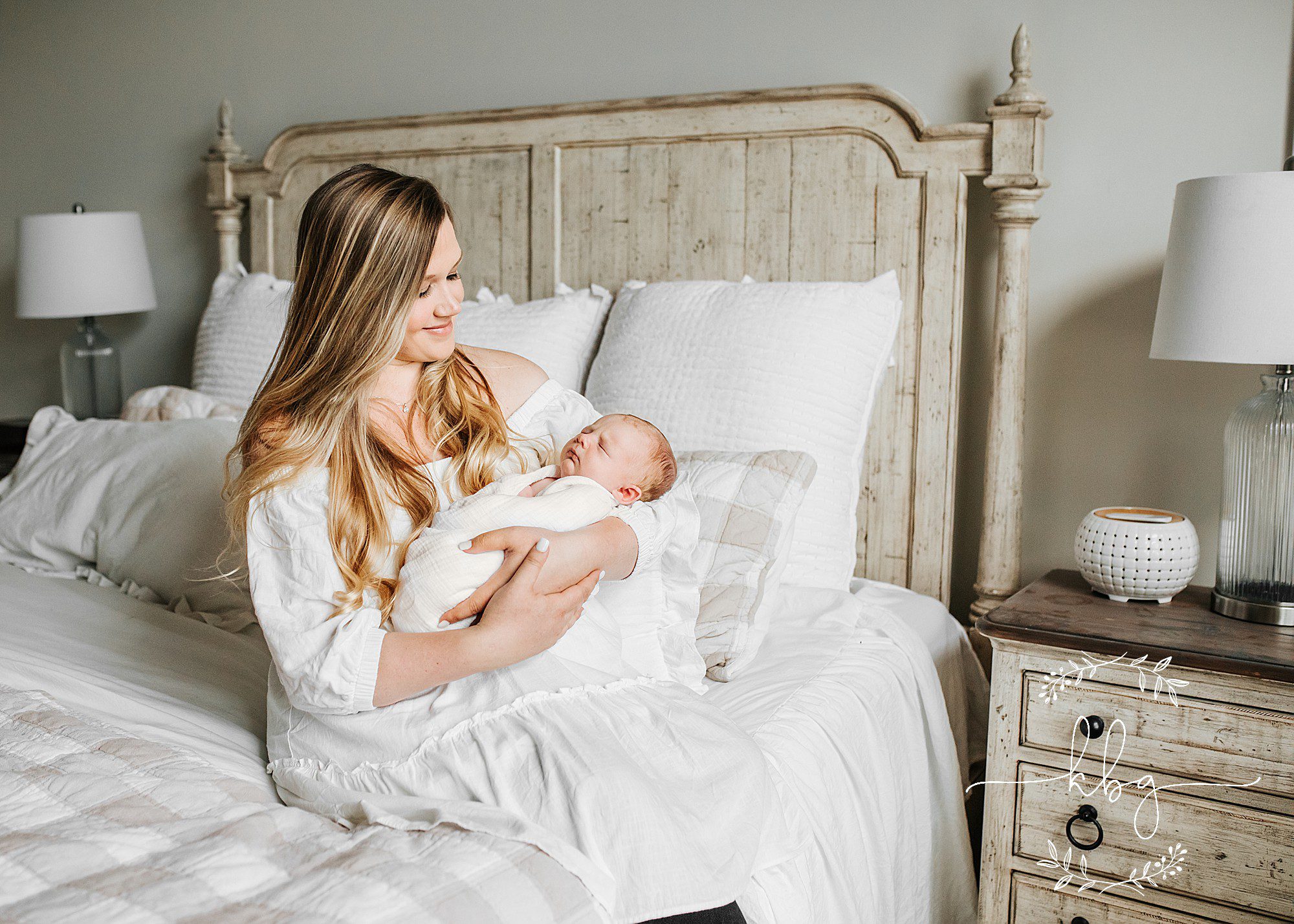 mama holding baby boy on bed - atlanta newborn session