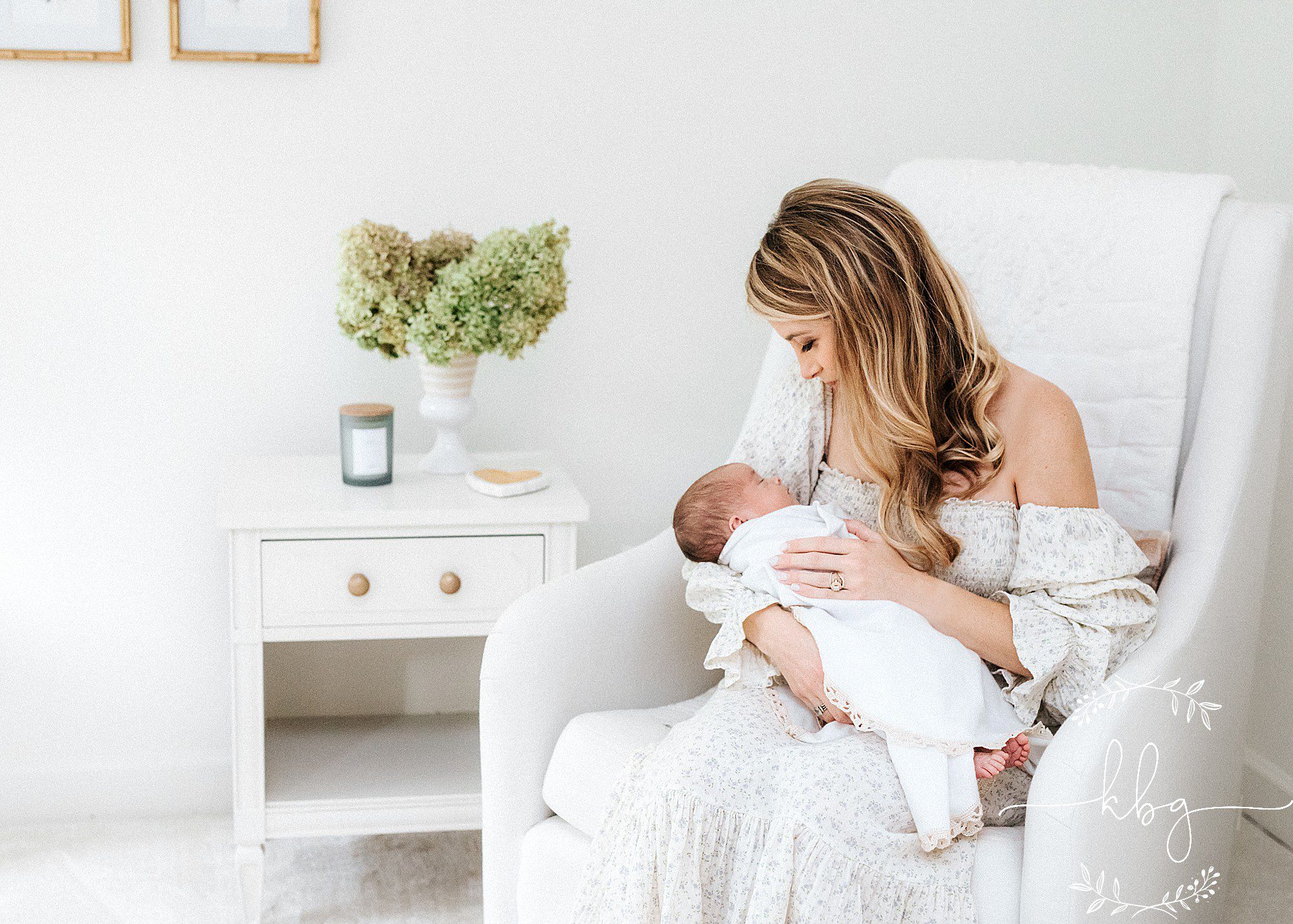 mom and baby sitting in nursery chair - marietta newborn session